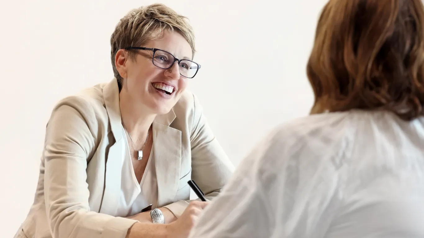 Krista Padgett in conversation with a client